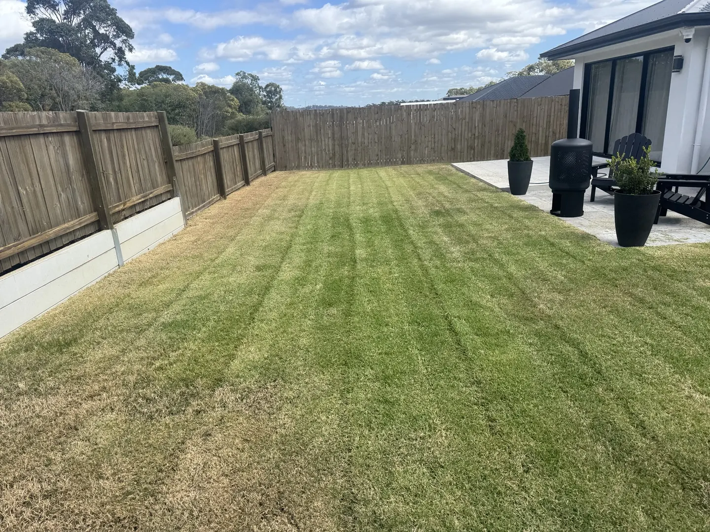 Freshly Mown Backyard — completed outdoor maintenance by Greenstone Outdoor Solutions