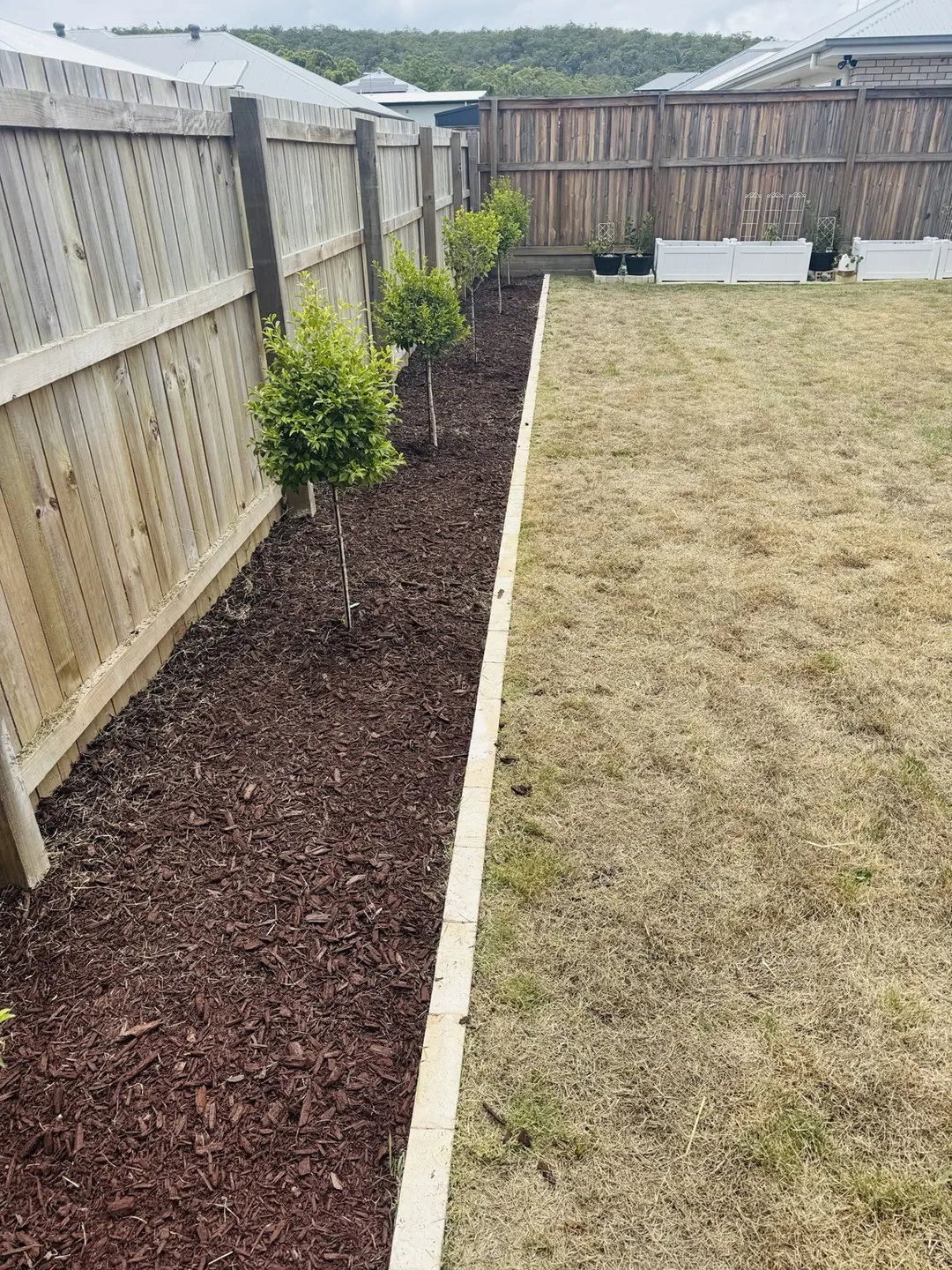 Garden Bed Mulching — completed outdoor maintenance by Greenstone Outdoor Solutions