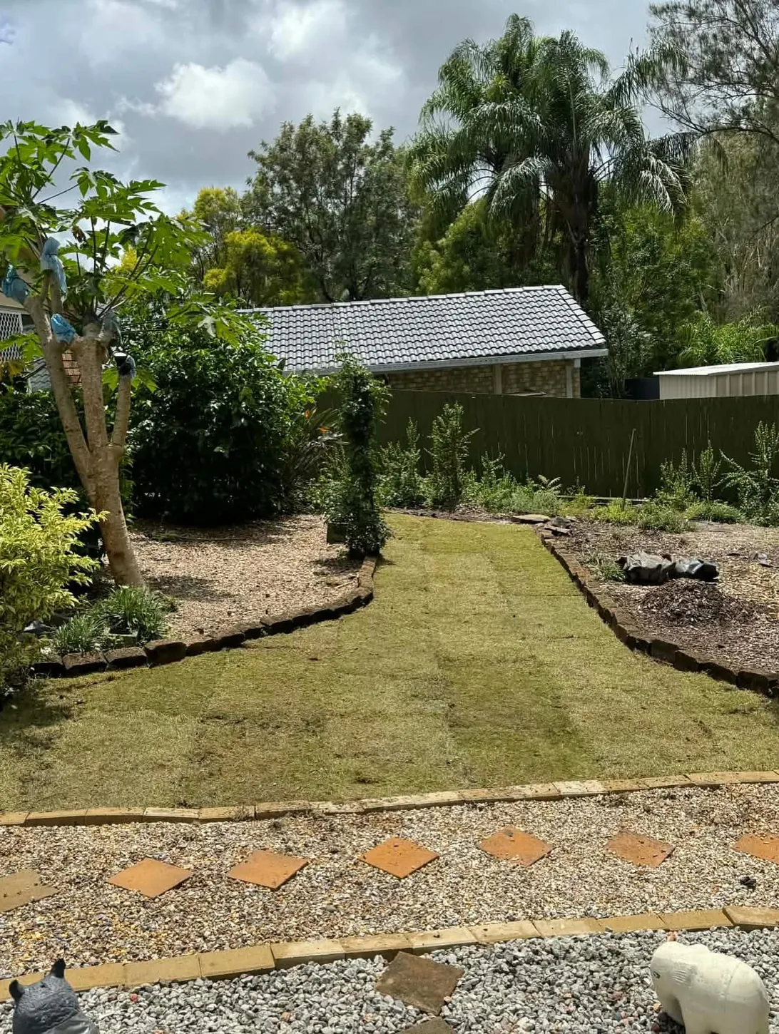 Newly laid turf at a completed residential lawn installation
